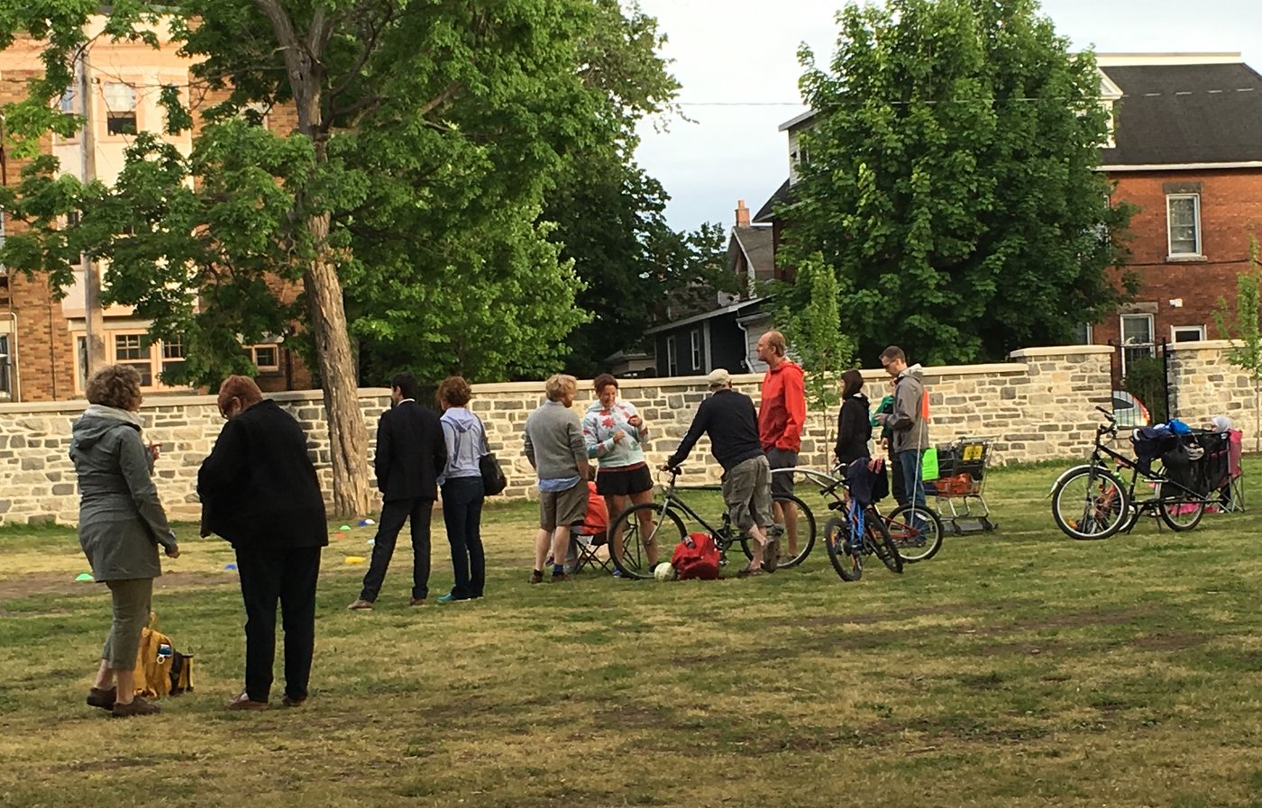 Things baseball parents say — parents gathered talking on the sidelines at a youth sports park