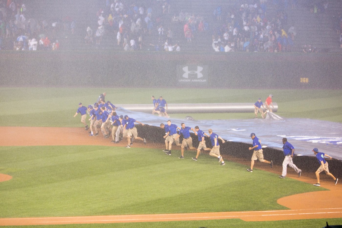 Scariest things in youth baseball — grounds crew pulling the tarp during a rain delay