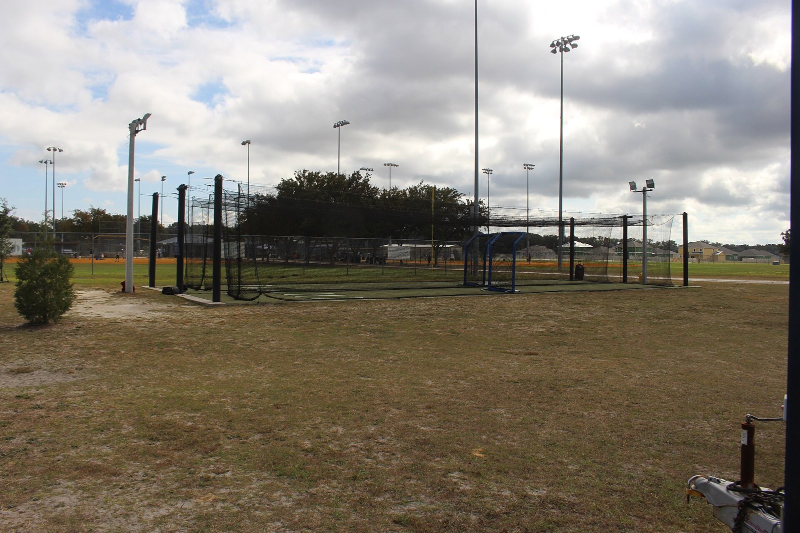 Outdoor batting cages at a youth complex — a common setup for youth baseball offseason training hitting work